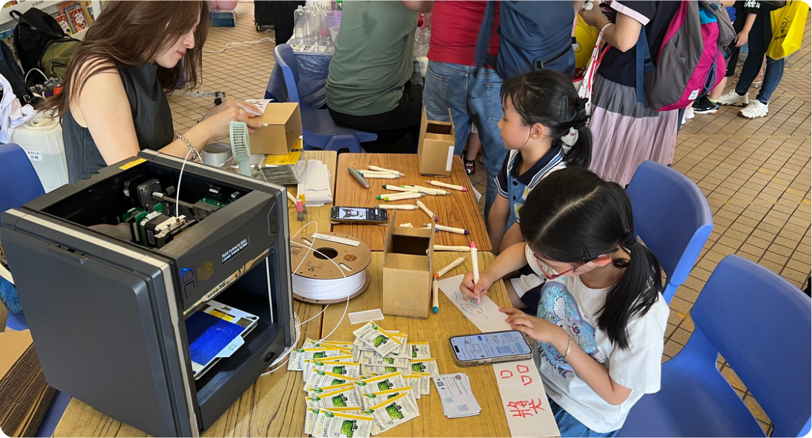Eastern District Primary School Tour visitors exploring a 3D printer